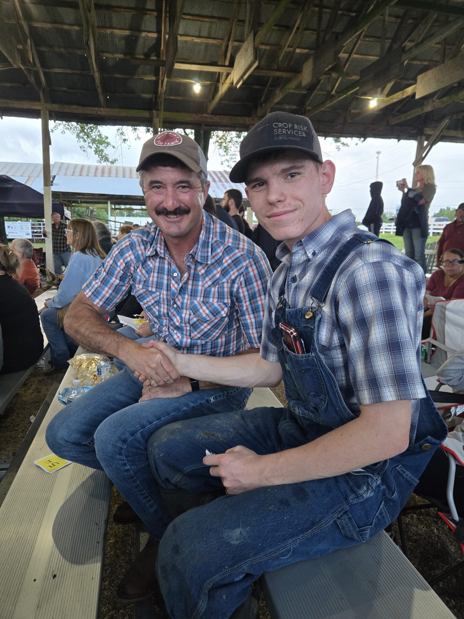 Mr. Toby Thompson (owner of SnS Recycling) and Lucas after Toby's purchase of Lucas' hog 2025. Mr. Toby Thompson (owner of SnS Recycling) and Lucas after Toby's purchase of Lucas' hog 2025.