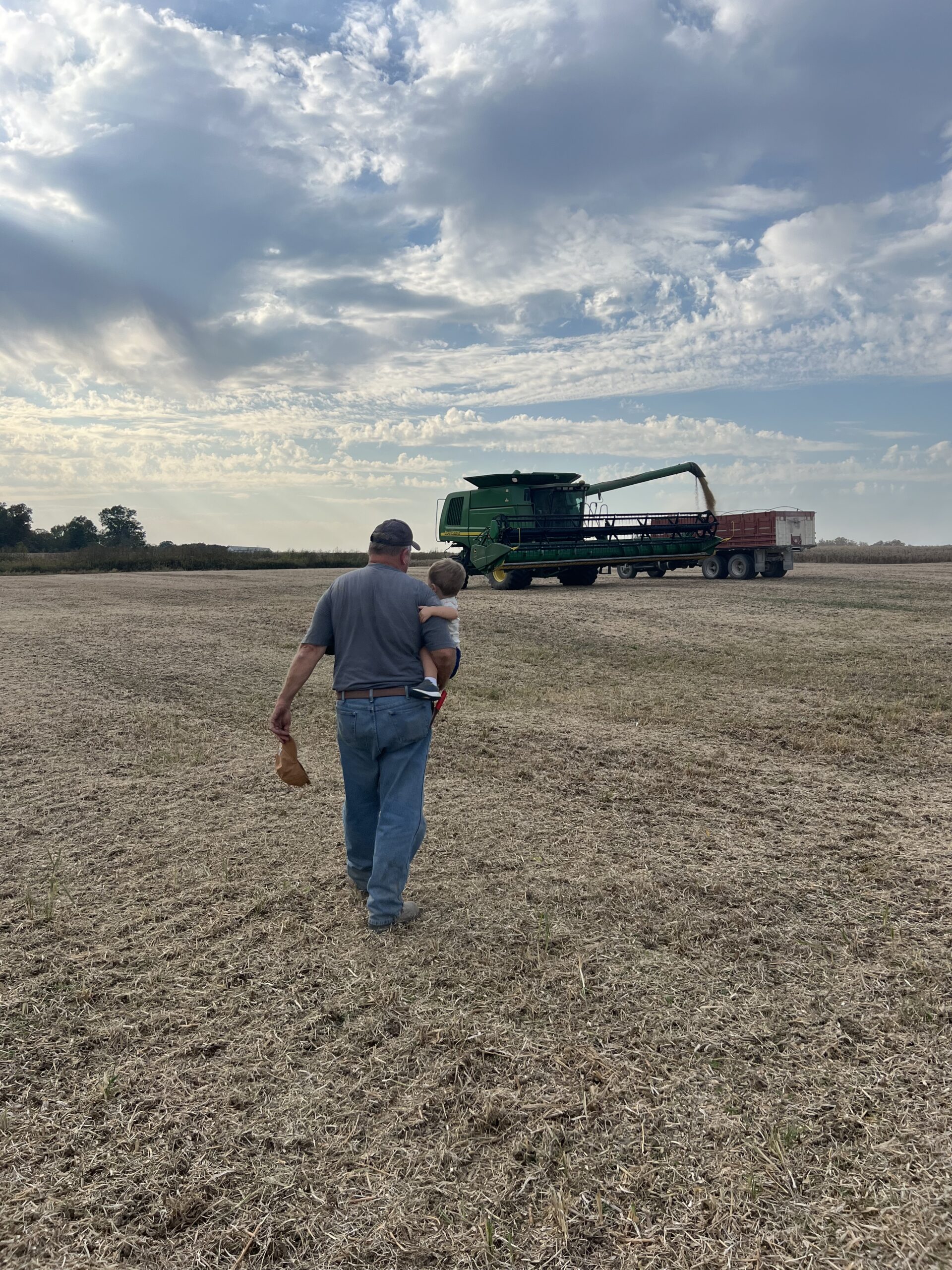 Grandpa and Leighton headed to the combine Grandpa and Leighton headed to the combine